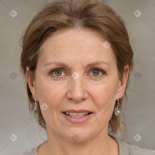 Joyful white adult female with medium  brown hair and grey eyes