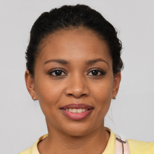 Joyful latino young-adult female with short  brown hair and brown eyes