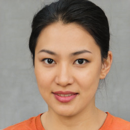 Joyful asian young-adult female with medium  brown hair and brown eyes