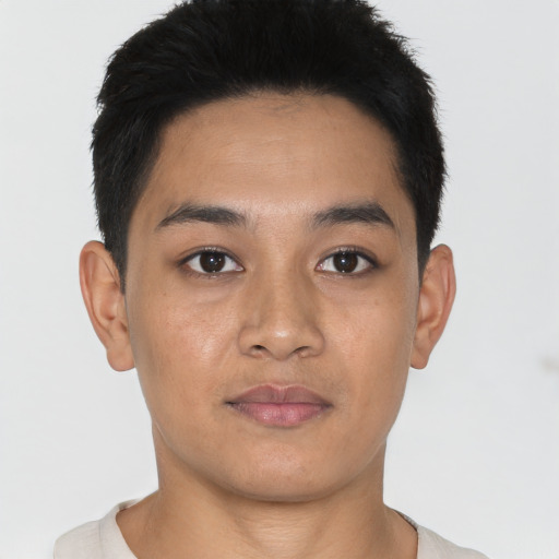 Joyful asian young-adult male with short  brown hair and brown eyes
