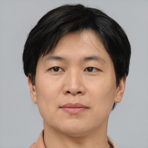 Neutral asian adult male with short  black hair and brown eyes