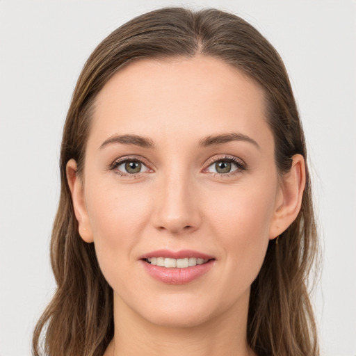 Joyful white young-adult female with long  brown hair and grey eyes