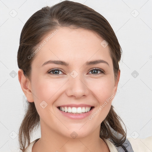 Joyful white young-adult female with medium  brown hair and grey eyes