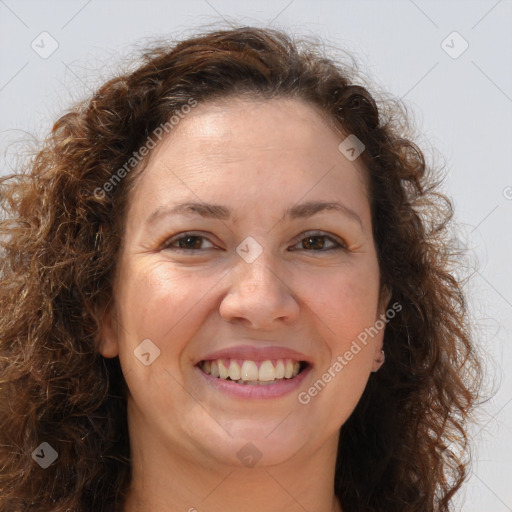 Joyful white adult female with long  brown hair and brown eyes