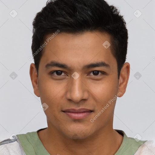 Joyful latino young-adult male with short  brown hair and brown eyes