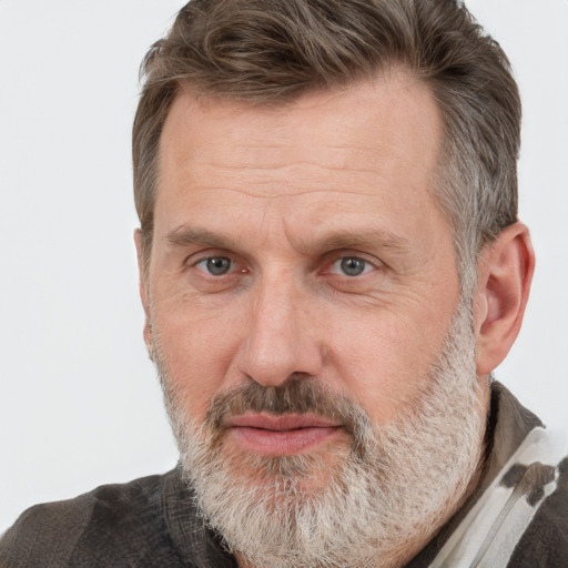 Joyful white middle-aged male with short  brown hair and grey eyes