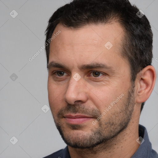 Joyful white adult male with short  brown hair and brown eyes