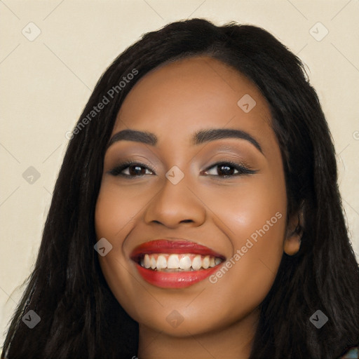 Joyful latino young-adult female with long  black hair and brown eyes