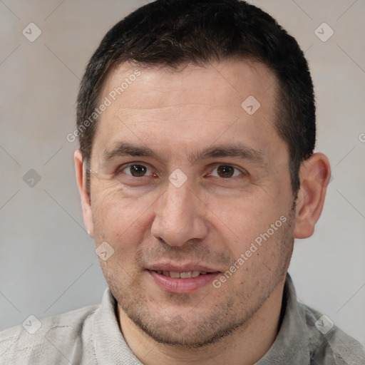 Joyful white adult male with short  brown hair and brown eyes