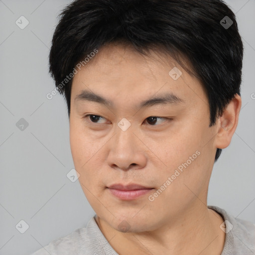 Neutral asian young-adult male with short  brown hair and brown eyes