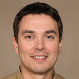 Joyful white young-adult male with short  brown hair and brown eyes