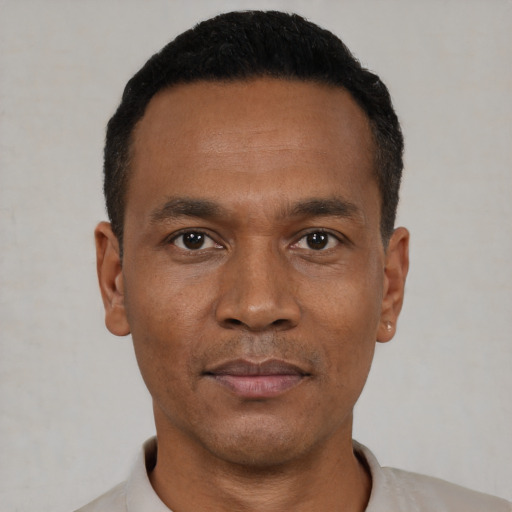 Neutral black young-adult male with short  black hair and brown eyes