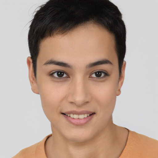 Joyful latino young-adult female with short  black hair and brown eyes