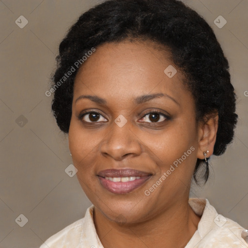 Joyful black adult female with short  brown hair and brown eyes