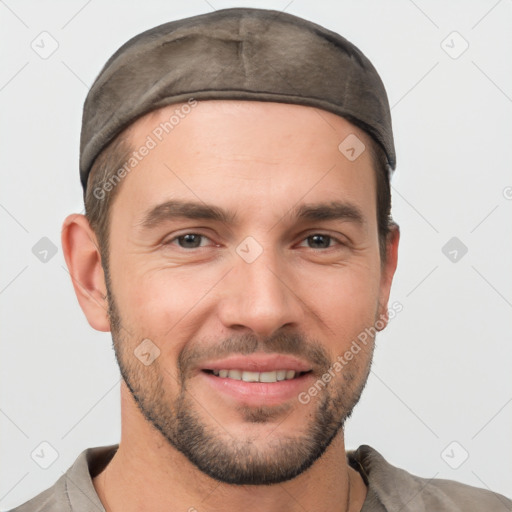 Joyful white young-adult male with short  brown hair and brown eyes