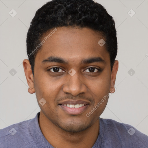 Joyful black young-adult male with short  black hair and brown eyes