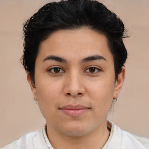Joyful latino young-adult female with short  black hair and brown eyes