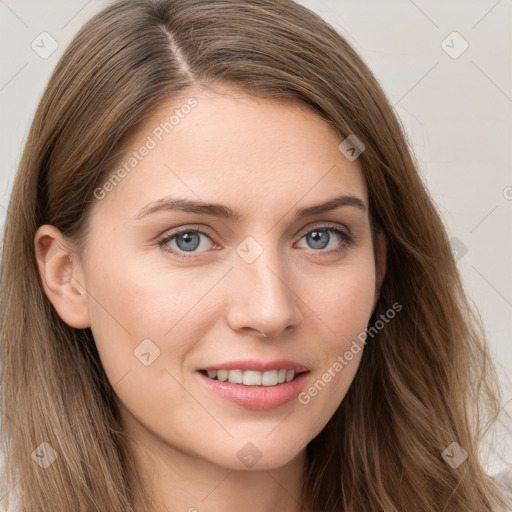 Joyful white young-adult female with long  brown hair and blue eyes