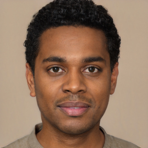 Neutral black young-adult male with short  black hair and brown eyes