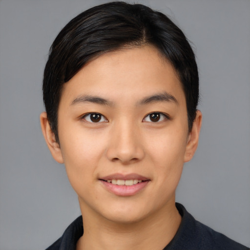 Joyful asian young-adult female with short  black hair and brown eyes