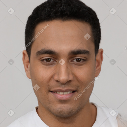 Joyful latino young-adult male with short  black hair and brown eyes