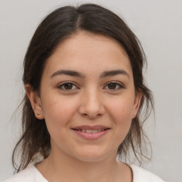 Joyful white young-adult female with medium  brown hair and brown eyes