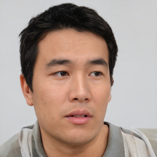 Neutral asian young-adult male with short  black hair and brown eyes