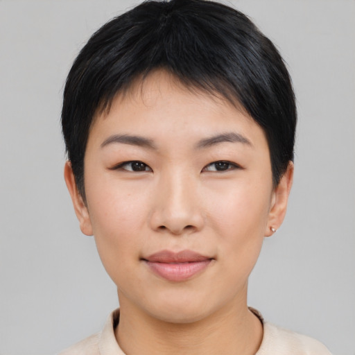 Joyful asian young-adult female with short  black hair and brown eyes