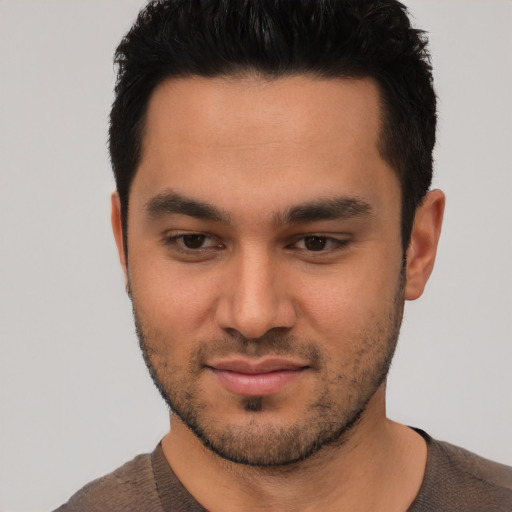 Joyful asian young-adult male with short  brown hair and brown eyes