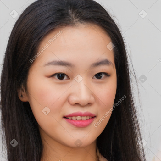 Joyful asian young-adult female with long  brown hair and brown eyes