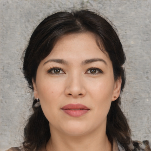 Joyful asian young-adult female with medium  brown hair and brown eyes