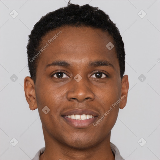 Joyful black young-adult male with short  brown hair and brown eyes