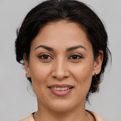 Joyful white young-adult female with medium  brown hair and brown eyes