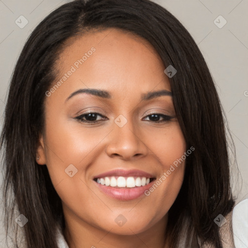 Joyful latino young-adult female with long  brown hair and brown eyes