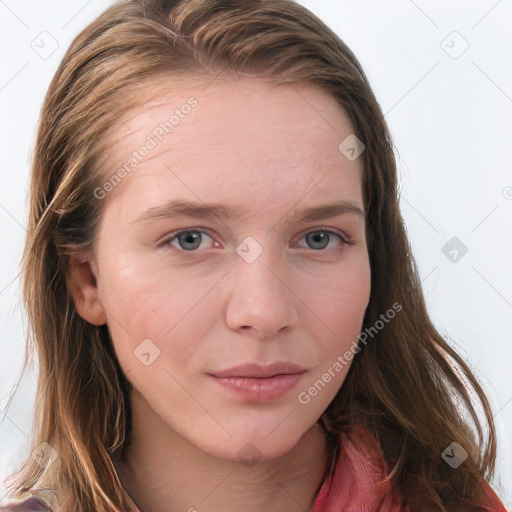 Joyful white young-adult female with long  brown hair and blue eyes