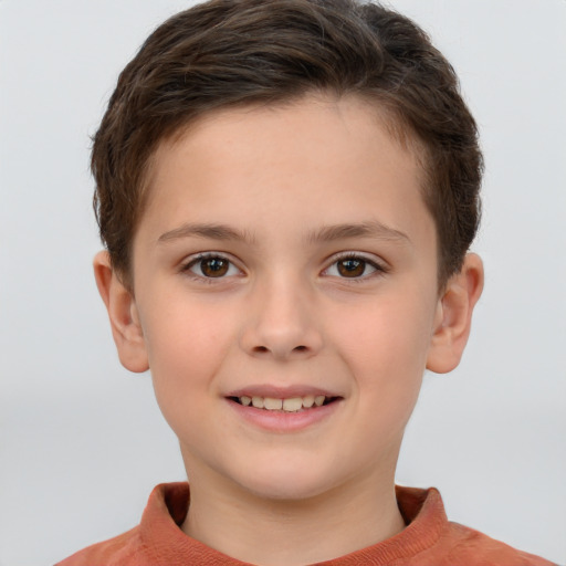 Joyful white child female with short  brown hair and brown eyes