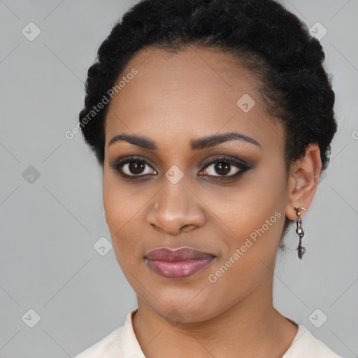 Joyful black young-adult female with short  black hair and brown eyes