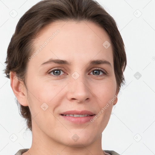 Joyful white young-adult female with short  brown hair and grey eyes