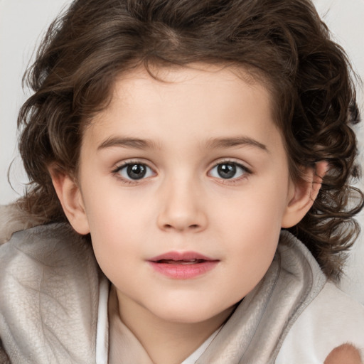 Joyful white child female with medium  brown hair and brown eyes