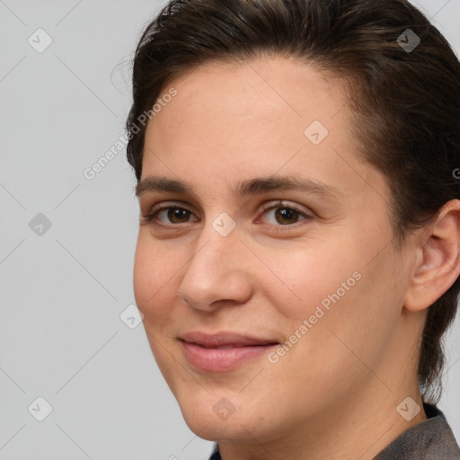 Joyful white young-adult female with medium  brown hair and brown eyes