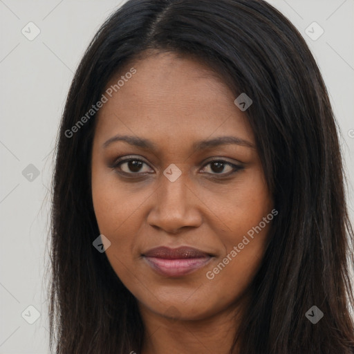 Joyful black young-adult female with long  brown hair and brown eyes