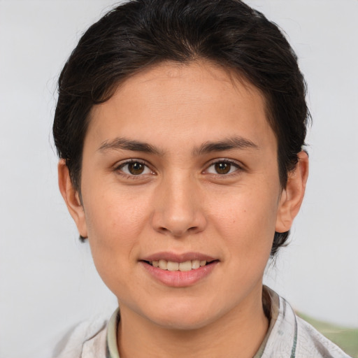 Joyful white young-adult female with short  brown hair and brown eyes