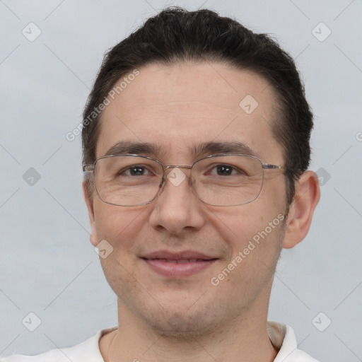 Joyful white adult male with short  brown hair and brown eyes