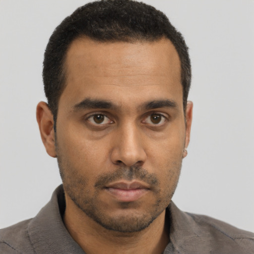 Neutral black young-adult male with short  brown hair and brown eyes