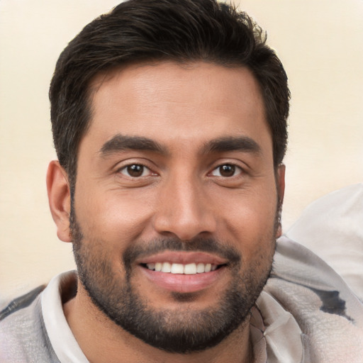 Joyful white young-adult male with short  brown hair and brown eyes