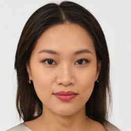 Neutral asian young-adult female with medium  brown hair and brown eyes