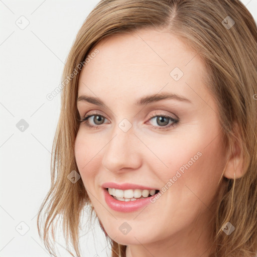 Joyful white young-adult female with long  brown hair and blue eyes