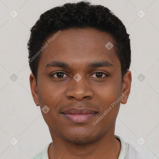 Joyful black young-adult male with short  brown hair and brown eyes
