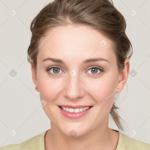 Joyful white young-adult female with medium  brown hair and blue eyes