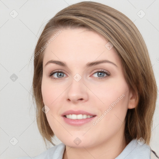 Joyful white young-adult female with medium  brown hair and blue eyes